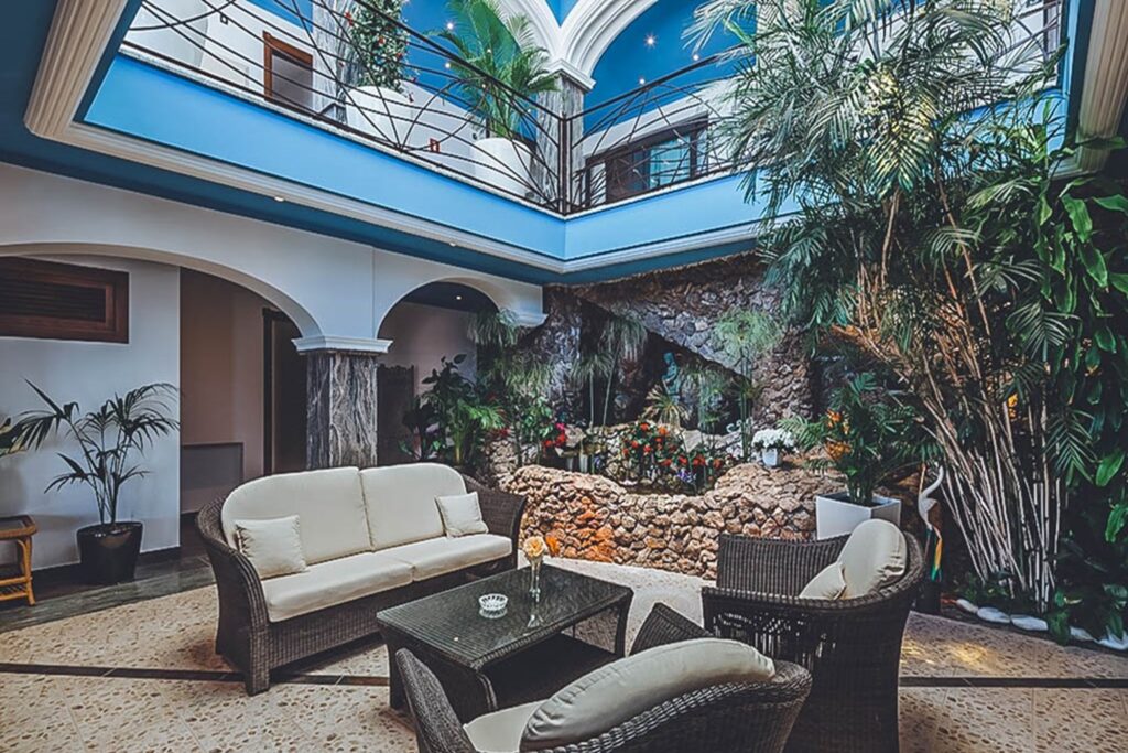 Interior courtyard, seating area with skylight and stone walls at Villa Jorden in Sa Carroca, Ibiza