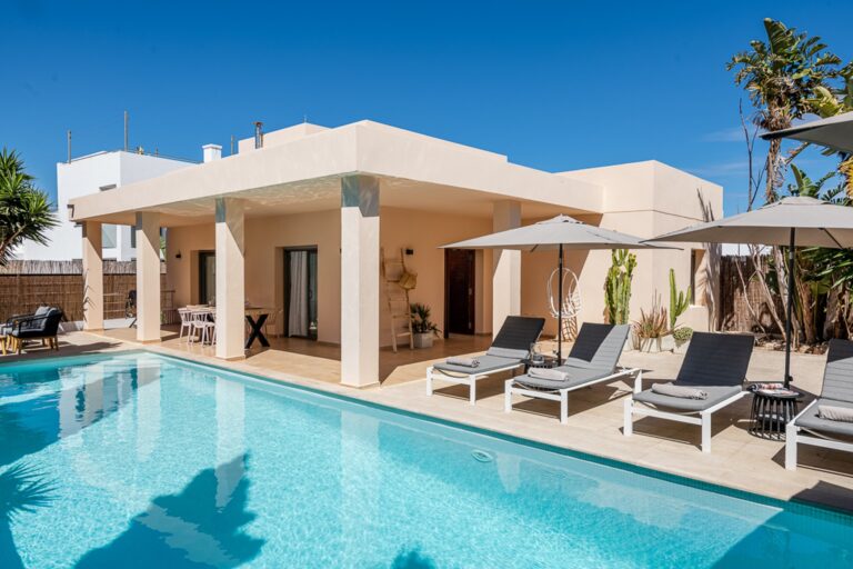 Villa exterior with pool and lounge seating area at Bijoux villa, luxury villa rental in Jesus, Ibiza