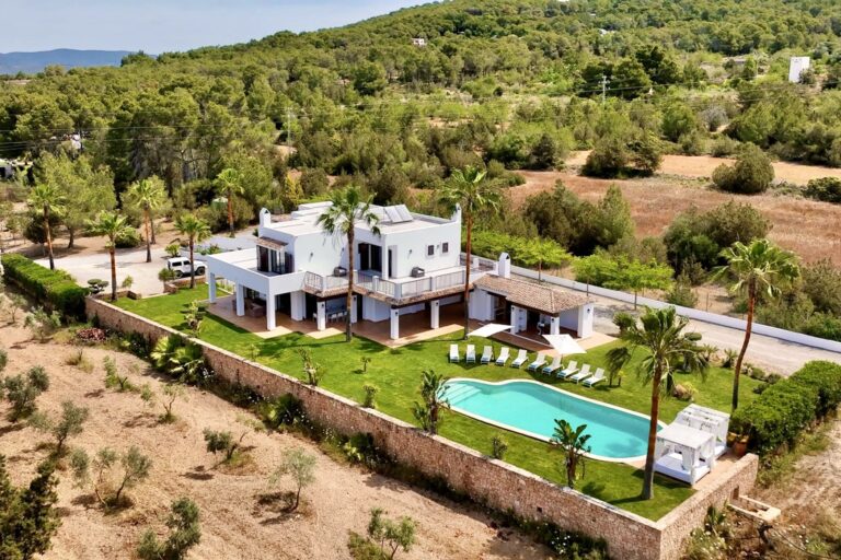 Aerial view, white villa with swimming pool and forest at Muca Haven, luxury villa rental in San Antonio, Ibiza