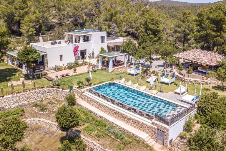Aerial view, villa with pool and pergola surrounded by forest at Casa Savanna, a luxury villa in San Antonio, Ibiza