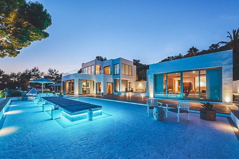 Interior, open-plan with blue seating and wooden beam ceiling at Villa Celeste, holiday villa in San Jose, Ibiza