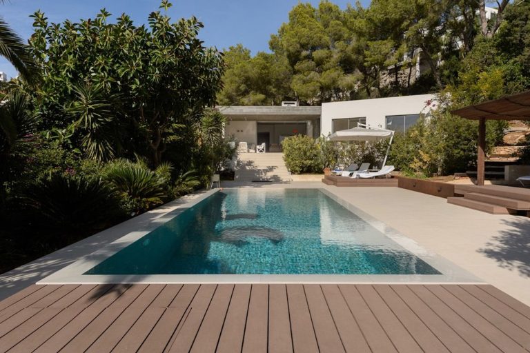 Exterior, modern villa with infinity pool and wooden terrace at Fico Residence, a luxury villa in Can Furnet, Ibiza